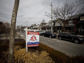 A for sale sign in a neighbourhood in Toronto