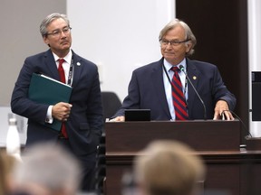 N.C. Sen. Bill Rabon shares his experience using marijuana illegally while undergoing chemotherapy to treat his cancer as Senate Bill 3, the NC Compassionate Care Act, is discussed during a House health committee meeting in Raleigh, N.C., Tuesday, May 30, 2023. Sen. Michael Lee stands to the left.