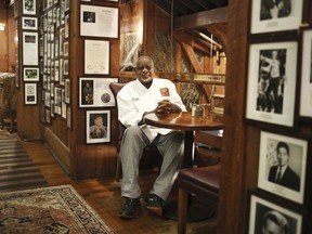 Angus Barn executive chef Walter Royal sits in his favorite spot in the Angus Barn, a Raleigh, N.C., institution, Wednesday, Feb. 19, 2020. Royal, the chef of a destination steakhouse in North Carolina who triumphed on "Iron Chef America" by cooking mostly southern dishes with ostrich meat, has died Monday, May 22, 2023, at the age of 67. The Angus Barn in Raleigh, where Royal served as executive chef since the 1990s, announced his passing on its website.