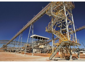 New ore conveyors above the ore crushing unit, center, at Newcrest Mining Ltd.'s Telfer Mine in the Pilbara region of Western Australia.  Photographer: Will Burgess/Bloomberg