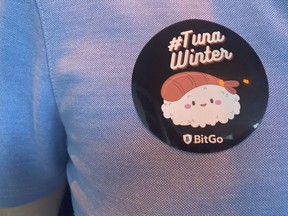 BitGo party-goer with "#TunaWinter" sticker