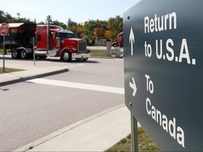 A truck leaves the Canada-United States border crossing.