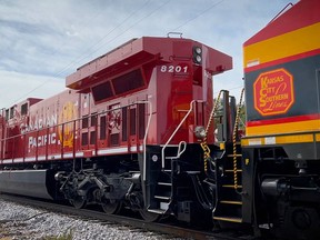 A train with KCS and CP locomotives in Camanche, Iowa.