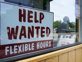 File - A help wanted sign is displayed in Deerfield, Ill., on Wednesday, Sept. 21, 2022. On Thursday, the Labor Department reports on the number of people who applied for unemployment benefits last week.