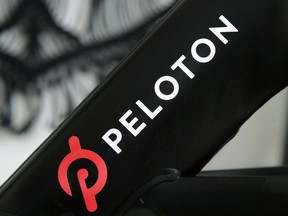 FILE - A Peloton logo is seen on the company's stationary bicycle on Nov. 19, 2019, in San Francisco, Calif. Peloton is recalling more than 2 million of its exercise bikes because the bike's seat post assembly can break during use, posing fall and injury hazards.