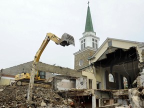 This image provided by Lloyd Wolf shows the demolition of Arlington Presbyterian Church in Arlington, Va, in 2016. In its place now stands Gilliam Place, a six-story affordable housing complex with 173 apartments. Hundreds of faith groups are using their property to build homes. For cash-poor congregations that face declining revenue and member participation and rising maintenance costs, developing housing can offer a financial benefit while also expanding their social mission.