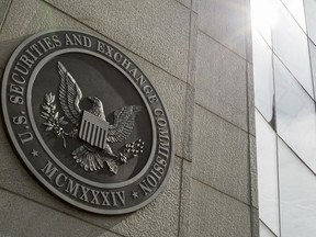 FILE - The seal of the U.S. Securities and Exchange Commission at SEC headquarters in Washington is seen, June 19, 2015. A bipartisan group of more than a two dozen lawmakers are asking the SEC to put the brakes on an initial public offering by Chinese fast fashion retailer Shein until it verifies it does not use forced labor from the country's predominantly Muslim Uyghur population.