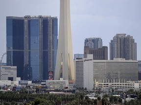 FILE - The partially completed Fontainebleau Las Vegas, the blue building on the left, stands along the skyline, Aug. 29, 2017, in Las Vegas. Fountainebleau Las Vegas announced Tuesday morning, May 2, 2023, that it plans to open its doors to the public in December 2023. The towering blue-glass resort -- one of Las Vegas' tallest building -- has sat unfinished on the Strip for more than a decade.