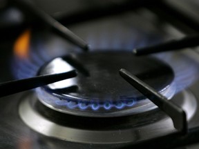 FILE - A gas-lit flame burns on a natural gas stove, Jan. 11, 2006, in Stuttgart, Germany. New York state plans to ban natural gas stoves and furnaces in most new buildings, a policy aimed at reducing greenhouse gas emissions without making people replace their beloved cooking equipment.