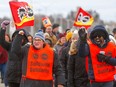 Members of Public Service Alliance of Canada picket in Kingston, Ont., during the strike in April.