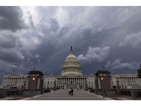 WASHINGTON, DC - MAY 16: A storm cloud hangs over the U.S. Capitol Building on May 16, 2022 in Washington, DC. This week the U.S. Senate is expected to take up a vote on a $40 billion package of military and humanitarian aid to Ukraine.
