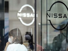 Logos at a Nissan showroom are seen in Ginza shopping district in Tokyo on March 31, 2023. Japanese automaker Nissan reported Thursday, May 11, a seven-fold surge in January-March profit and forecast strong sales for this fiscal year riding on the popularity of its new model offerings.