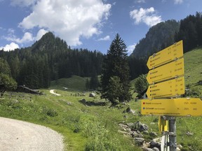 Signposts that provide estimated hiking times and degrees of difficulty appear along a trail in the Berchtesgaden National Park in Germany on June 27, 2022. Experts say not only can a gap year help you figure out what to study, it also gives you a year to work and save money to avoid debt later down the line – if you set goals and stick to a budget.