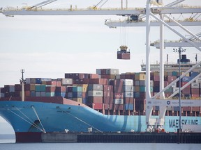 A ship is unloaded in Vancouver. Statistics Canada reported May 4 that the value of imports dropped 2.9 per cent in March from February, and 5.9 per cent in volume terms.