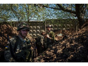 Ukrainian servicemen near Bakhmut, Donetsk region, Ukraine, on May 3. Photographer: Dimitar Dilkoff/AFP/Getty Images