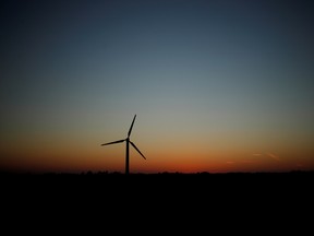 A wind turbine seen at sunset in Britain.