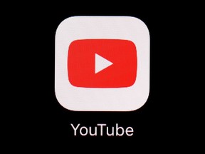 FILE - The YouTube app is displayed on an iPad in Baltimore on March 20, 2018. YouTube is great at sending users videos that it thinks they'll like based on their interests. But new research shows the site's powerful algorithms can also flood young users with violent and disturbing content. The non-profit Tech Transparency Project created YouTube accounts mimicking the behavior of young boys with an interest in first-person shooter games.