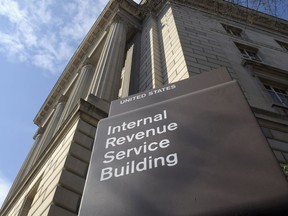 FILE - The exterior of the Internal Revenue Service (IRS) building in Washington, on March 22, 2013. In an effort to stop personal threats aimed at IRS employees, the agency says it will start limiting the workers' personal identifying information on communications with taxpayers.