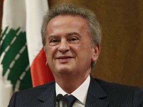 Riad Salameh, Lebanon's Central Bank governor, speaks during a press conference in Beirut, on Nov. 11, 2019. A Lebanese judge questioned the country's embattled central bank governor Wednesday and confiscated his Lebanese and French passports preventing him from leaving the country following an arrest warrant from France over corruption charges, judicial officials said.