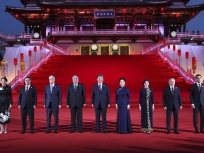 In this photo released by China's Xinhua News Agency, Chinese President Xi Jinping, center, and his wife Peng Liyuan, forth right, pose for a photo with Central Asian leaders at the Ziyun Tower in Xi'an in northwester China's Shaanxi Province, Thursday, May 18, 2023. Chinese leader Xi Jinping promised to build more railway and other trade links with Central Asia and proposed jointly developing oil and gas sources at a meeting Friday with the region's leaders that highlighted Beijing's growing influence.