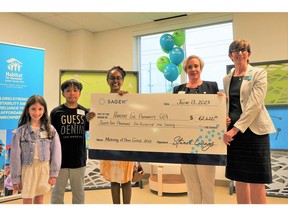 L-R: Students Daphne U., JL B. and Eldana A, Sagen Vice President of Business Development Kiki Sauriol-Roode and Habitat for Humanity GTA CEO Ene Underwood. Three Toronto-area national writing contest winners and founding sponsor Sagen present Habitat for Humanity GTA with grant of more than $60,000 to build affordable homes in Toronto.