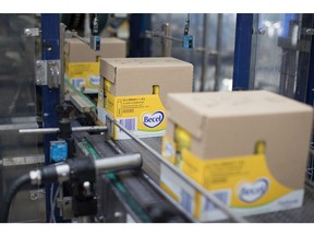 Boxes of Becel squeezy bottle margarine pass along the packaging line inside the Unilever NV factory in Rotterdam, Netherlands, on Thursday, May 11, 2017. Unilever Plc's announcement that it's looking at ending its dual nationality and basing itself in London or Rotterdam means Theresa May finds her Brexit strategy facing either a big endorsement or an early blow.