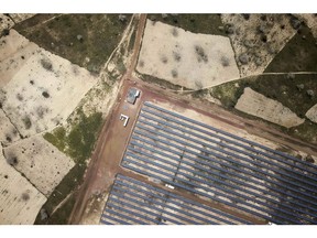 Photovoltaic solar panels sit in an array at the Senergy Santhiou Mekhe PV solar plant in this aerial photograph taken in Thies, Senegal, on Monday, Oct. 16, 2017. The electricity produced at the 30 megawatt site, West Africa's largest to date, will be bought by the Senegal National Electricity Company (SENELEC) and injected into the national network.