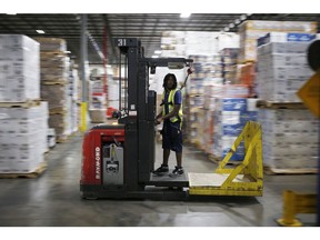 A warehouse worker drives a forklift in the warehouse at Southern Glazer's Wine & Spirits distribution center in Louisville, Kentucky, U.S., on Friday, Sept. 28, 2018. Photographer: Luke Sharrett/Bloomberg