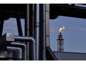 A gas flare burns from a torch column at the Grupa Lotos SA oil refinery in Gdansk, Poland, on Tuesday, July 28, 2020. Polish refiner PKN Orlen won conditional European Union approval to buy rival Lotos after agreeing on a extensive commitments package designed to allay potential competition concerns. Photographer: Bartek Sadowski/Bloomberg