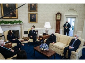 Jamie Dimon, right, during a meeting in the Oval Office with President Joe Biden, center, at the White House in Washington, on Feb. 9, 2021. Photographer: Pete Marovich/Pool/Getty Images