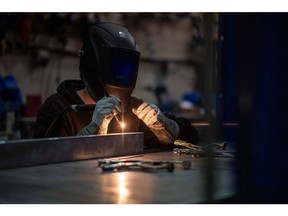 A welder works at a fabrication and welding shop in Langford, British Columbia, Canada, on Thursday, Feb. 10, 2022. Statistics Canada (STCA) is scheduled to release manufacturing sales figures on February 17. Photographer: James MacDonald/Bloomberg