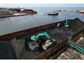 Coal on a barge loaded onto trucks at Cirebon Port in West Java, Indonesia, on Wednesday, May 11, 2022. Trade has been a bright spot for Indonesia, which has served as a key exporter of coal, palm oil and minerals amid a global shortage in commodities after Russia's invasion of Ukraine.