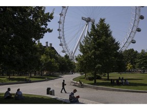 LONDON, UNITED KINGDOM - JULY 19: Members of the public take advantage of the shade near the London Eye on July 19, 2022 in London, United Kingdom. Temperatures were expected to hit 40C in parts of the UK this week, prompting the Met Office to issue its first red extreme heat warning in England, from London and the south-east up to York and Manchester.