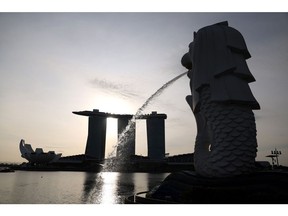 The Merlion statue and the Marina Bay Sands Hotel in Singapore, on Tuesday, Jan. 3, 2023. Singapore's recovery held up in 2022, with a relatively strong year-end performance shoring up the economy ahead of an expected global slowdown this year. Photographer: Lionel Ng/Bloomberg
