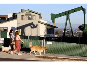 An idle oil pumpjack near homes in Signal Hill, California on Feb. 9.