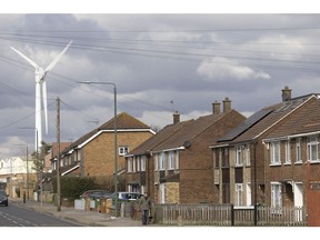 A wind turbine near residential properties in the Slade Green district of Greater London, UK, on Monday, Feb. 27, 2023. Homebuyers are getting the edge in the UK property market as sellers cut their asking prices to get deals done. Photographer: Jason Alden/Bloomberg
