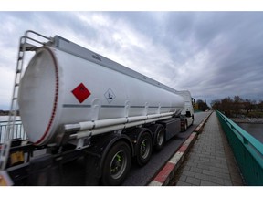 An oil tanker truck travels along a bridge over the Hohensaaten-Friedrichsthal waterway in Schwedt, Germany, on Monday, March 20, 2023. Germany's economy will probably shrink in the first quarter of the year, according to the ZEW institute's gauge of expectations, as concerns over risks in the banking sector add to headwinds from inflation, even as the rate should decline "significantly", the Bundesbank said. Photographer: Krisztian Bocsi/Bloomberg