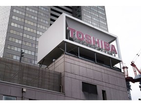 Signage for Toshiba Corp. displayed at the company's headquarters in Tokyo, Japan, on Friday, March 24, 2023. Toshiba accepted a buyout offer from a Japanese consortium, as the iconic conglomerate moved a step closer to ending a troubled chapter in its more-than-140-year history. Shares jumped on Friday in Tokyo. Photographer: Kosuke Okahara/Bloomberg
