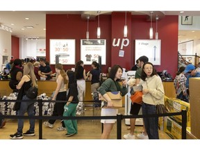 Shoppers in a Sport Experts store in Brossard, Quebec, Canada, on Sunday, April 16, 2023. Inflation drifted lower to the slowest pace in nearly two years, a reprieve for the Bank of Canada amid a jobs market and economy that continue to defy expectations for a stall.