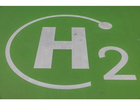 A H2 logo at a green hydrogen refuelling station for Transporte Metropolitano de Barcelona (TMB) city buses, operated by Iberdrola SA, in Barcelona, Spain, on Monday, April 24, 2023. A new 16.3 billion euro green energy plan, partly financed by European Union recovery funds, aims to develop green hydrogen projects, increase renewable power capacity and build new storage facilities. Photographer: Angel Garcia/Bloomberg