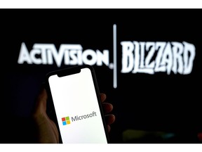 The Microsoft logo on a smartphone arranged in the Brooklyn borough of New York, US, on Monday, May 16, 2023. Microsoft Corp.'s $69 billion takeover of Activision Blizzard Inc. won European Union approval, putting the bloc at odds with its UK and US counterparts. Photographer: Gabby Jones/Bloomberg