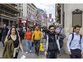 Shoppers on Oxford Street in London, UK, on Thursday, May 25, 2023. UK retailers saw sales jump more than expected last month, recovering from heavy rain that kept people home the month before.