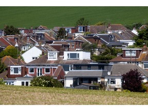 Residential houses next to arable fields in Brighton, UK, on Wednesday, May 31, 2023. UK house prices resumed their decline, with Nationwide Building Society warning that headwinds for property sellers are increasing. Photographer: Chris Ratcliffe/Bloomberg