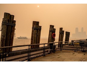 NEW YORK, NEW YORK - JUNE 7: A boat passes by Battery Park amid a smoky haze from wildfires in Canada on June 7, 2023 in New York City. New York topped the list of most polluted major cities in the world on Tuesday night, as smoke from the fires continues to blanket the East Coast.