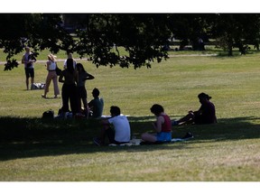 Visitors rest under the shade of a tree in Primrose Hill in London, UK, on Saturday, June 10, 2023. Soaring temperatures caused by a blast of hot air led the UK to post fresh health warnings through the weekend.