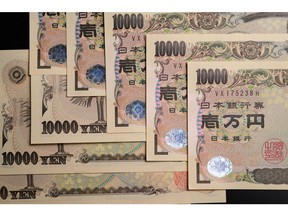 Japanese 10,000 yen banknotes arranged in Kawasaki, Japan, on Friday, June 23, 2023. Tokyos FX traders are scanning the airwaves for official comments as the yen slumps toward levels where the government intervened to prop it up last year. Photographer: Akio Kon/Bloomberg