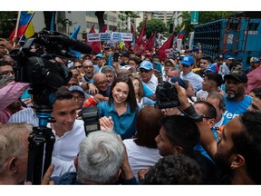 Maria Corina Machado, a former lawmaker and opposition leader, center, marches with supporters at Altamira Square in Caracas, Venezuela, on Friday, June 23, 2023. Machado has ridden a surge in popularity to lead a pack of opposition candidates ahead of the Oct. 22 primary vote that will decide who gets to take on President Nicolas Maduro in next year's elections. Photographer: Gaby Oraa/Bloomberg
