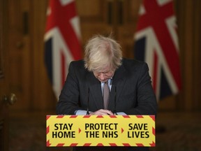 FILE - Britain'sPrime Minister Boris Johnson reacts while leading a virtual news conference on the COVID-19 pandemic, inside 10 Downing Street in central London on Jan. 26, 2021. Former U.K. Prime Minister Johnson says he's quitting as a lawmaker after being told he will be sanctioned for misleading Parliament. Johnson quit on Friday, June 9, 2023 after receiving the results of an investigation by lawmakers over misleading statements he made to Parliament about a slew of gatherings in government that breached pandemic lockdown rules.