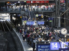 FILE - Numerous travelers wait for their train, in Hamburg, Germany, Central Station Friday, April 21, 2023. A German rail workers' union said Thursday, June 22, 2023 that it will hold a ballot of its members on all-out strike action after long-running pay talks with the main national railway operator broke down.