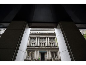 The Bank of Japan headquarters is seen through a neighboring building in Tokyo.